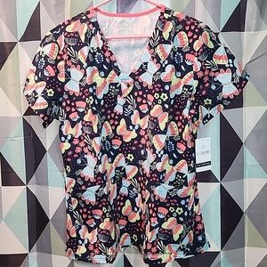 Lot of three female nurse scrub tops.